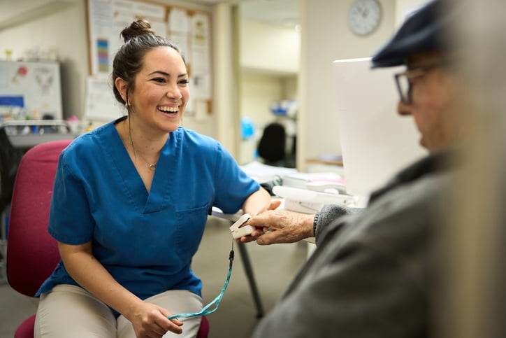 APP Nurse helping a patient